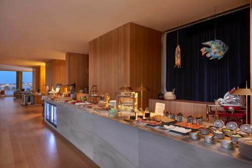 a buffet line with many different types of food at Melia Palma Bay in Palma de Mallorca