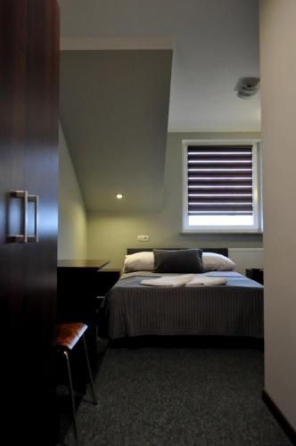 Postel nebo postele na pokoji v ubytování Hotel Pauza