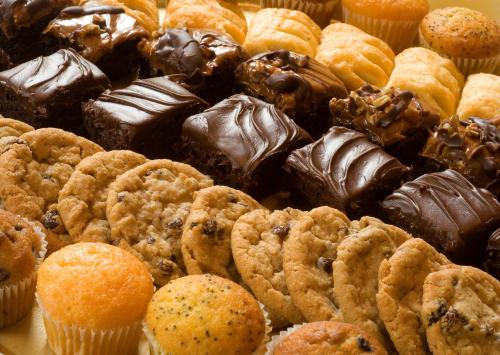 a bunch of different types of donuts and pastries at Hotel Abades Guadix in Guadix