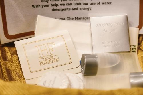 a close up of a bottle of lipstick and other cosmetics at Hotel Residence Federiciano in Valenzano