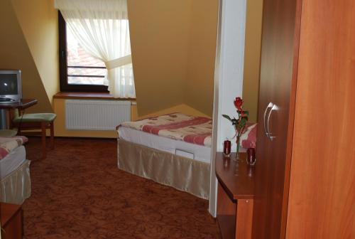 
Ein Bett oder Betten in einem Zimmer der Unterkunft Hotel Anka
