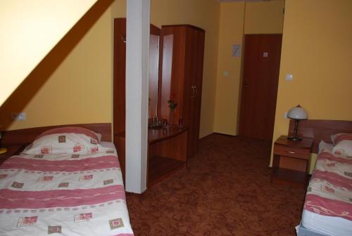 Cama o camas de una habitación en Hotel Anka