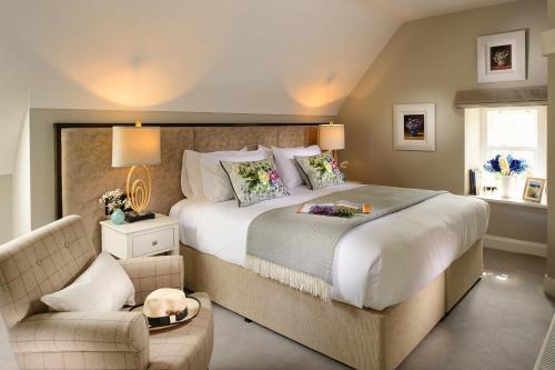 a bedroom with a large bed and a couch at The Hawthorn in Doolin