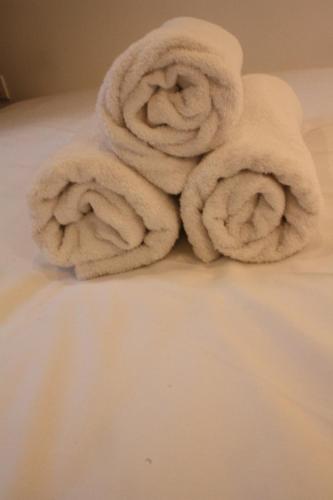 a pile of towels sitting on top of a bed at Alpage 1 in Avoriaz