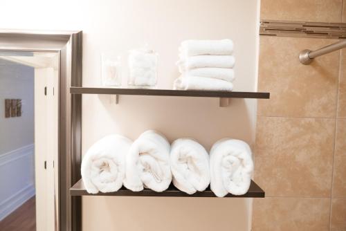 a towel rack with towels in a bathroom at Calm & Well-Equipped 2BR Chicago Apartment - Central Cozy in Dunning