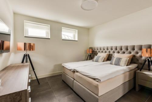 Katil atau katil-katil dalam bilik di Luxury Family Residence Schinkeldijkje