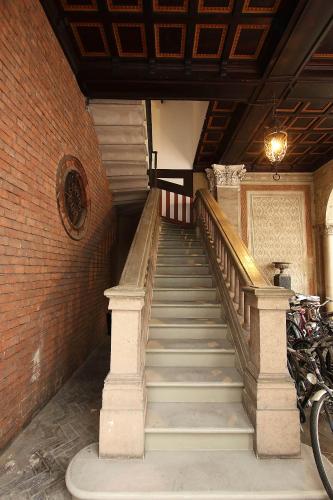 a staircase in a building with a brick wall at SAHI - Residenza Bianca di Savoia in Milan