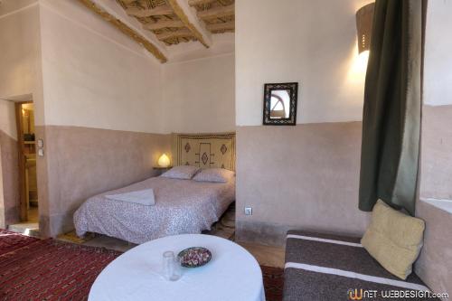 Ένα ή περισσότερα κρεβάτια σε δωμάτιο στο Kasbah Agoulzi