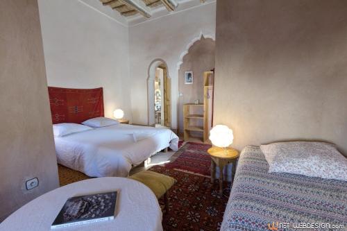 Ένα ή περισσότερα κρεβάτια σε δωμάτιο στο Kasbah Agoulzi