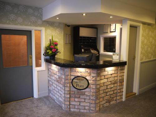 a kitchen with a brick counter top in a room at The Port Hotel in Portrush