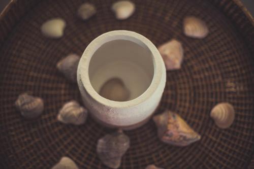 a bathroom floor with rocks around a white toilet at RocaMar Hostel Boutique in Punta del Este