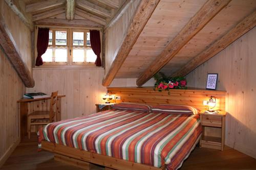 Postel nebo postele na pokoji v ubytování Hotel Garni Plueme