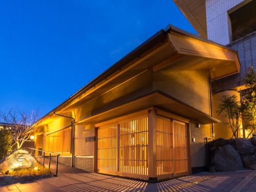 a building with a large door on the side of it at Saka Hotel Kyoto in Kyoto