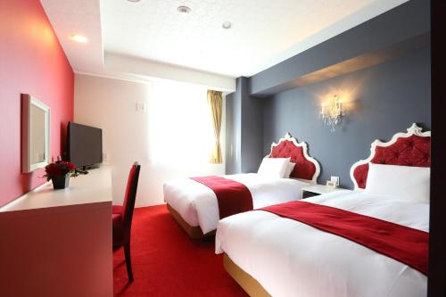 Кровать или кровати в номере Hotel Wing International Select Nagoya Sakae