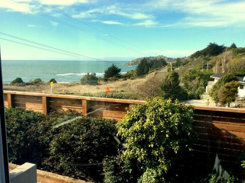 a view of the ocean from a house at Noah's Boutique Accommodation Moeraki in Moeraki