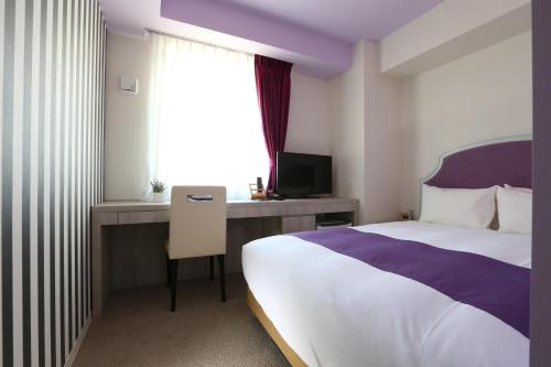 Кровать или кровати в номере Hotel Wing International Select Nagoya Sakae