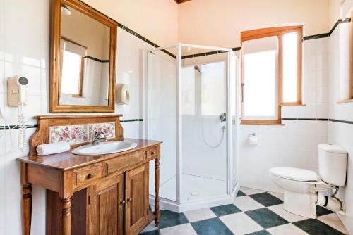 a bathroom with a sink and a shower at Halswell Lodge in Wellington