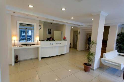 a hotel lobby with a reception desk and a reception counter at Sinopark Hotel in Sinop