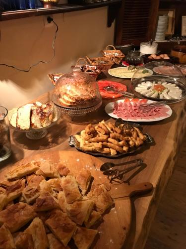 a table topped with lots of different types of food at Aloni Toy Kir Thanasi Hotel & Spa in Volakas