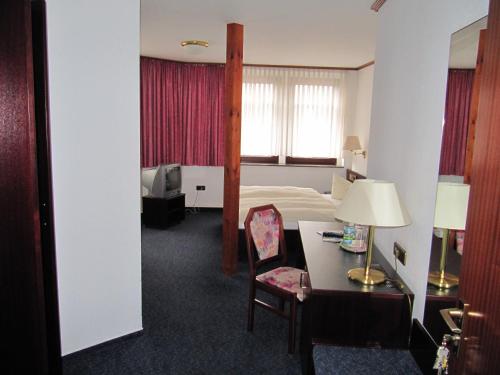 Postel nebo postele na pokoji v ubytování Hotel Wettin