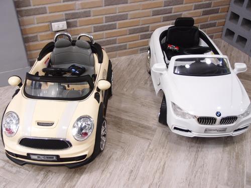 a white car parked next to a small white car at 23 Here B&B in Hualien City