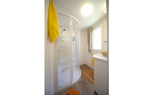 a bathroom with a shower and a sink at Camping villaggio L'Ultima spiaggia in Bari Sardo