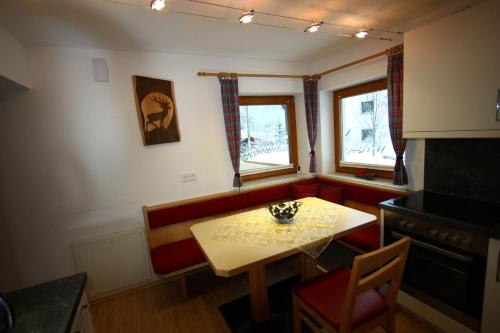a small dining room with a table and chairs at Ferienhaus Panorama in Biberwier