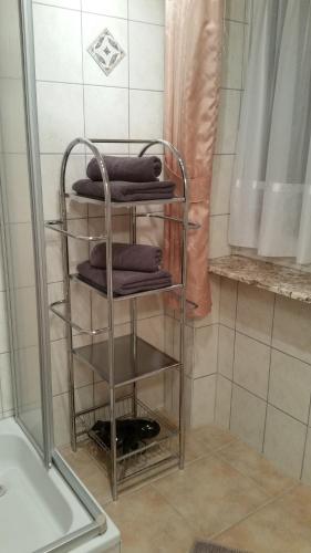 a towel rack in a bathroom with some towels at Ferienwohnungen Maurer in Umhausen