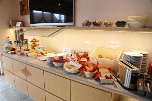 a buffet line with various food items on it at Leidringer Gästehaus GmbH in Rosenfeld