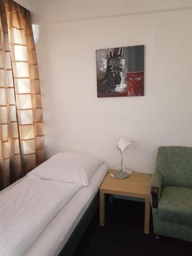 Ένα ή περισσότερα κρεβάτια σε δωμάτιο στο Hotel Wandsbek Hamburg