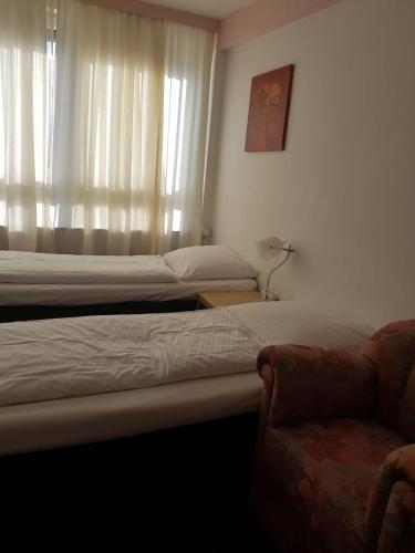 Ένα ή περισσότερα κρεβάτια σε δωμάτιο στο Hotel Wandsbek Hamburg