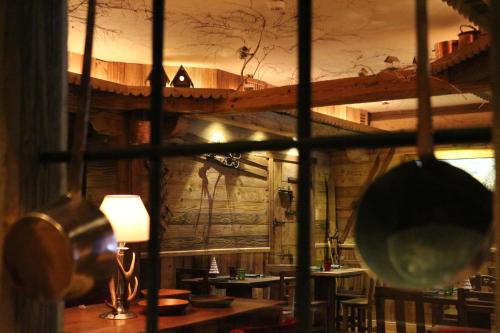 a view of a room with a table and chairs at Gran Baita Hotel & Wellness in Courmayeur