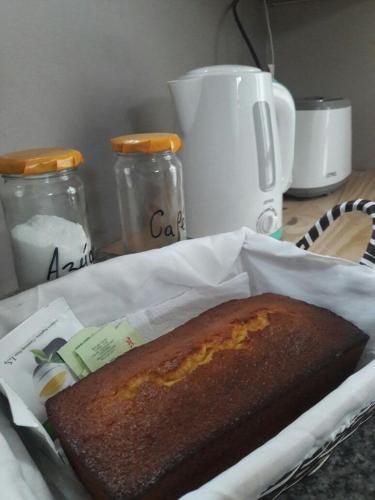 a loaf of bread in a basket on a table at El Tamarisco in Puerto Pirámides