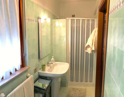 a bathroom with a sink and a shower at Magralù 2 B&B in Alghero