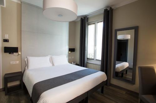 מיטה או מיטות בחדר ב-Hotel Ristorante Eurossola