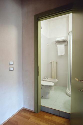 a bathroom with a toilet and a sink at Certosa 1515 in Avigliana