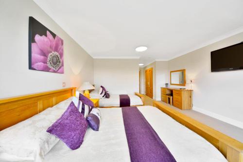 Postel nebo postele na pokoji v ubytování Peggyslea Farm B&B