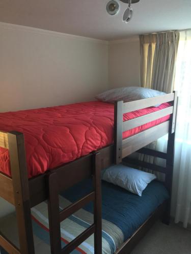 Postel nebo postele na pokoji v ubytování Departamento Concón