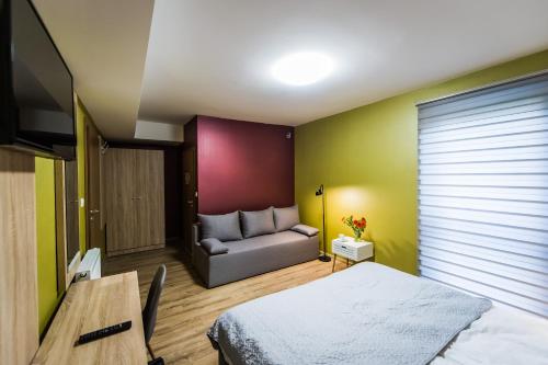 Postel nebo postele na pokoji v ubytování Apartamenty Eskapada