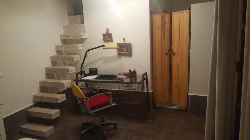 an office with a desk and a chair in a room at Dar d'Art in Marrakech