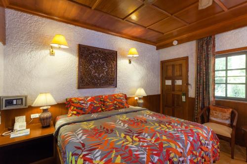Кровать или кровати в номере Tropica Bungalow Beach Hotel