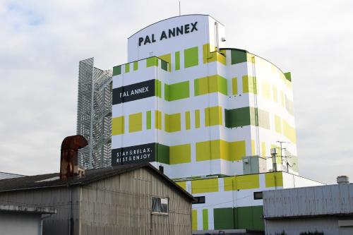 a tall building with a sign on top of it at Pal Annex Furugou in Oita