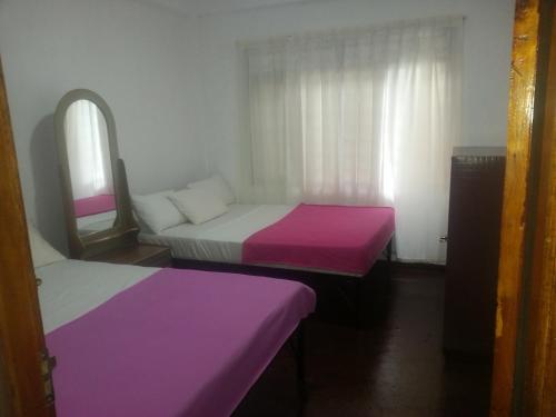 En eller flere senge i et værelse på See Fox Hill Resort