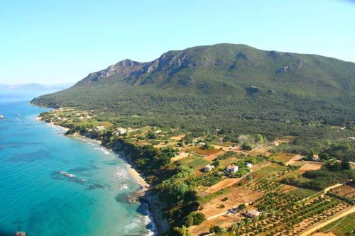 an aerial view of the ocean and a mountain at Liostasi in Halikounas