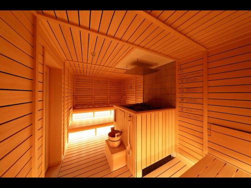 a sauna with a toilet in the middle of it at Do-c Shibuya Ebisu in Tokyo