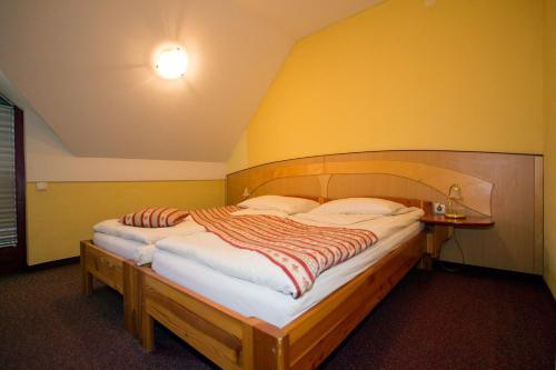 Säng eller sängar i ett rum på Guesthouse Jurcek