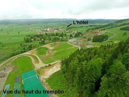 an aerial view of a construction site in a field at HOTEL Auberge du grand Git in La Chaux Neuve