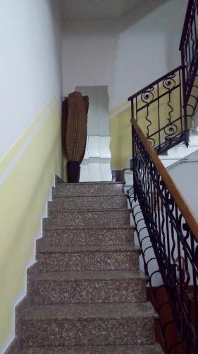 a set of stairs in a room with a stair case at Hotel Tirreno in Milan