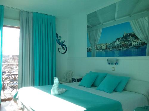 Кровать или кровати в номере Hostal La Carretera