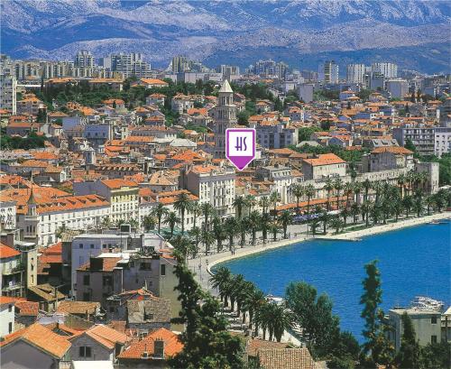 a city with a purple sign that says km at Slavija Culture Heritage Hotel in Split